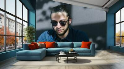 Photo bearded businessman relaxing modern loft office. Banker si Wall mural