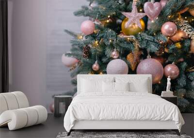 decorated christmas tree near white wall Wall mural