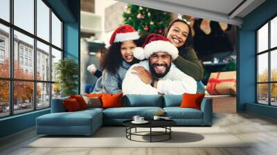 Christmas, portrait and happy family, living room floor and ground, winter celebration and love, care and happiness together. Parents, girl and excited child celebrate festive holidays in home lounge Wall mural