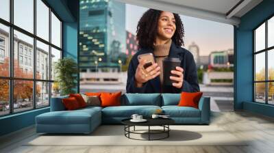 Coffee, phone or business woman travel in city, street or road with smile for communication, networking or social media news. Happy, New York or black woman with tea, smartphone or success tech deal Wall mural