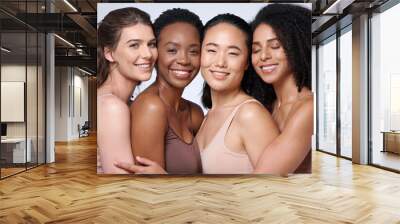 Face portrait, beauty and group of women in studio on gray background. Cosmetics, makeup and diversity of female models with glowing and flawless skin after spa facial treatment posing for skincare. Wall mural