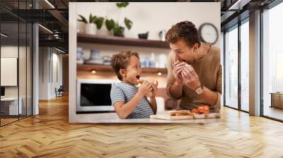 No one makes a better sandwich than dad. a man and his his having a sandwich at home. Wall mural