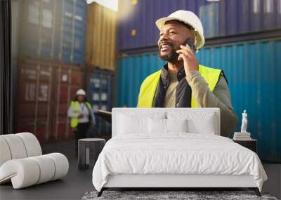 Logistics, shipping and construction worker on the phone with tablet in shipyard. Transportation engineer on smartphone in delivery, freight and international distribution business in container yard Wall mural