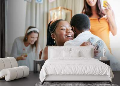 Thank you so much for coming. Shot of a young mother to be hugging her friend for a gift given at her baby shower. Wall mural