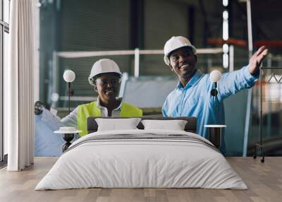 The safe way is the smart way. Shot of two builders having a meeting at a construction site. Wall mural