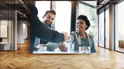 Business people, handshake and meeting for partnership, teamwork or collaboration in boardroom at office. Happy woman shaking hands in team recruiting, introduction or b2b agreement at the workplace Wall mural