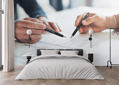 Detailing their success. Cropped shot of two unrecognizable businessmen discussing paperwork at the table in the boardroom. Wall mural