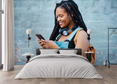 Black woman, smile and phone of a student from Jamaica with technology and headphones. Happy, urban and gen z person using 5g internet, web and social media app scroll while texting with happiness Wall mural