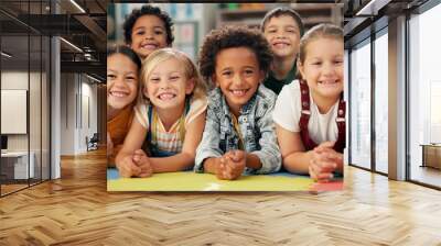 Kindergarten, kids and face with smile on floor for education, knowledge and learning at academy. Students, friends and happy with diversity in school for child development, scholarship and bonding Wall mural