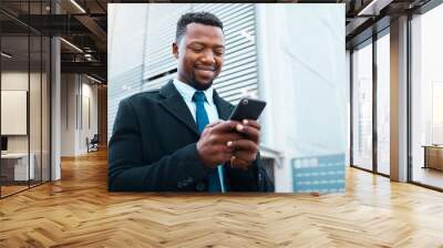 Phone, happy black man and business in city, street or outdoors on social media, web browsing or text message. Employee, entrepreneur and male in Nigeria internet surfing or research on 5g mobile app Wall mural