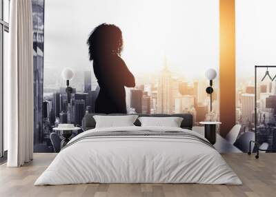 shes got big plans to run the city. silhouetted shot of a young businesswoman looking at a cityscape Wall mural