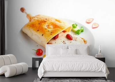 A single pastry with a creamy sauce and red cherry on a white plate. Wall mural