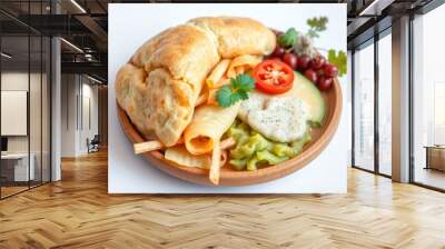 A wooden plate filled with a croissant, cheese slices, pasta, a tomato, avocado, and a side of grapes. Wall mural