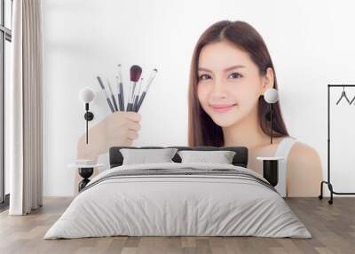 Beauty asian woman applying make up with brush on hand isolated on white background, beautiful of girl holding blusher, skincare and cosmetic concept. Wall mural