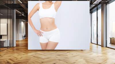 Closeup portrait young asian woman beautiful body diet with fit isolated on white background, model girl weight slim with health and wellness, weightloss concept. Wall mural