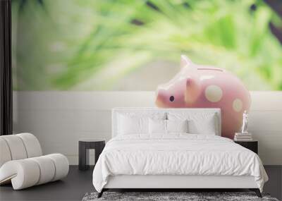 piggy bank on table with nature background, business concept. Wall mural