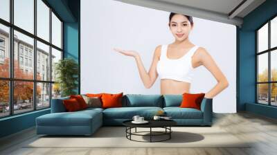 Portrait asian woman smiling beautiful body diet with fit presenting something empty copy space on hand isolated white background, model girl weight slim with cellulite, health and wellness concept. Wall mural