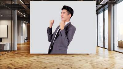 Portrait businessman in suit standing with win success isolated on white background, young asian business man is manager or executive having confident and excited is positive, expression and emotion. Wall mural