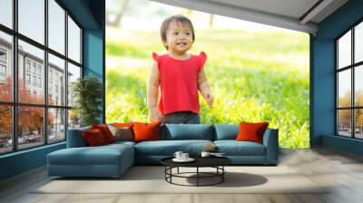 Portrait face of cute asian little girl and child happiness and fun in the park in the summer, smile and happy from asia kid and relax in the garden, lifestyle childhood concept. Wall mural