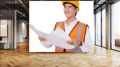 Portrait young asian man is engineer wearing helmet holding and looking blueprint with confident transparent, handsome male is architect or contractor, worker or labor concept. Wall mural