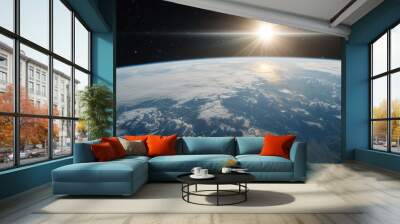 A breathtaking view of Earth's curvature from space, with the sun rising above the horizon, illuminating the planet's clouds and atmosphere. Wall mural