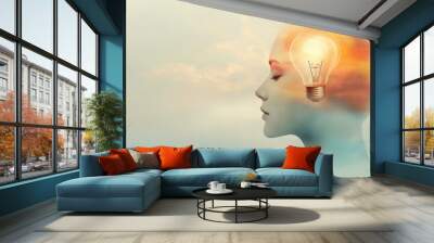 A silhouetted head with a glowing light bulb symbolizing creativity and inspiration, set against a dreamy, cloudy background to evoke imaginative thinking. Wall mural