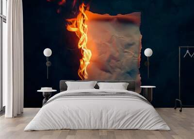 A piece of paper on fire dark background Wall mural