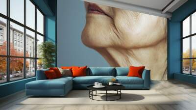 aging saggy skin on a woman's neck, with copy space. Soft, natural lighting. Simple, neutral background Wall mural