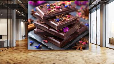 Handcrafted chocolate tablets with colorful spices and edible flowers soft defocused background Wall mural