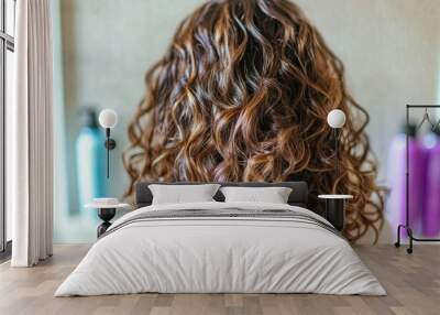 person with voluminous curly hair styling it in front of a mirror, Wall mural