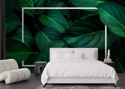 tropical leaves with white frame, abstract green leaves nature view of leaf in garden Wall mural