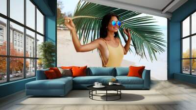 incredibly beautiful sexy girl models in a bikini on the sea shore of a tropical island with palm leaf, blonde brunette, bronze tan, travel summer vacation, fashion style Wall mural