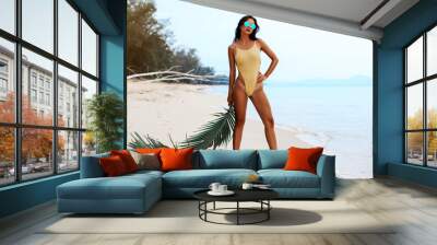 incredibly beautiful sexy girl models in a bikini on the sea shore of a tropical island with palm leaf, blonde brunette, bronze tan, travel summer vacation, fashion style Wall mural