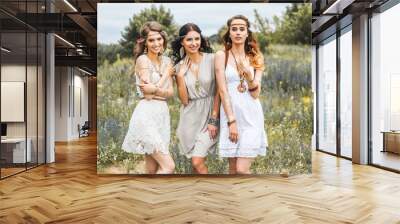 Summer holidays, travel and people concept -Three beautiful cheerful hippie girls, best friends, trendy hairstyles, feathers in her hair, white dress, tattoo flash, accessories, Bohemian, Boho Style Wall mural