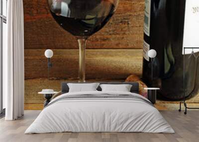 Glass of red wine and cheese on wood Wall mural