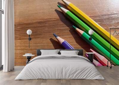 pencils on brown wooden background  Wall mural