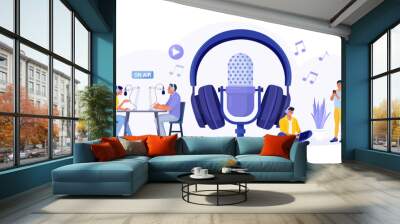 People recording podcast in radio studio. Female radio host interviewing guest with microphone. Man and woman in headphones talking. Mass media broadcasting. People listening music in headset Wall mural