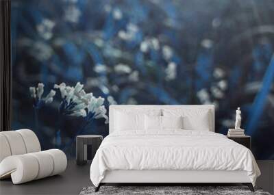 flowers forest. floral blue beautiful background. white flowers bloom in a clearing in the sunshine  Wall mural