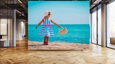 cute little girl with bag on tropical beach Wall mural