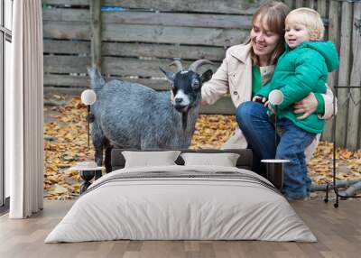 family touching goat in Zoo Wall mural