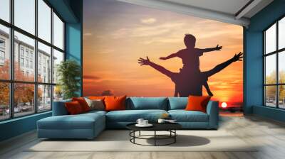 father and son on sunset beach Wall mural