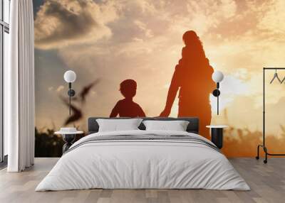 father with son and daughter walk at sunset Wall mural