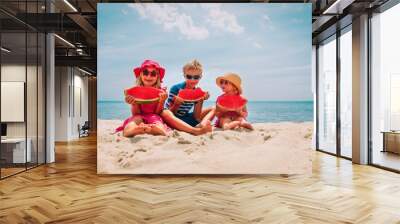 happy cute kids eating watermelon at beach Wall mural