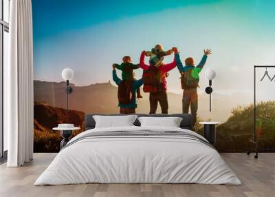 happy family travel in mountains at sunset Wall mural