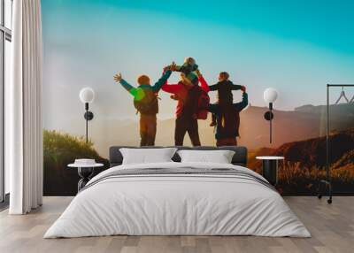 happy family travel in mountains at sunset Wall mural