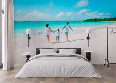 happy family with kid play run on beach Wall mural