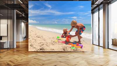 kids play with sand on summer beach Wall mural