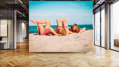 little boy and girl relax on tropical beach Wall mural