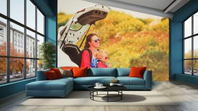 mother and little daughter travel by car Wall mural