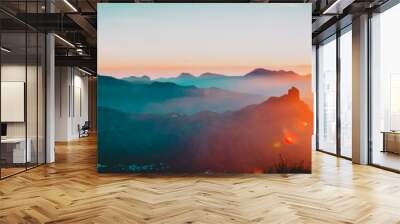 mother and son travel in mountains at sunset, panorama Wall mural